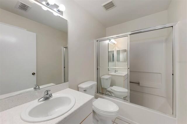 2015 W Del Webb Blvd, Sun City Center, FL 33573 - full bathroom featuring toilet, vanity, and combined bath / shower with glass door