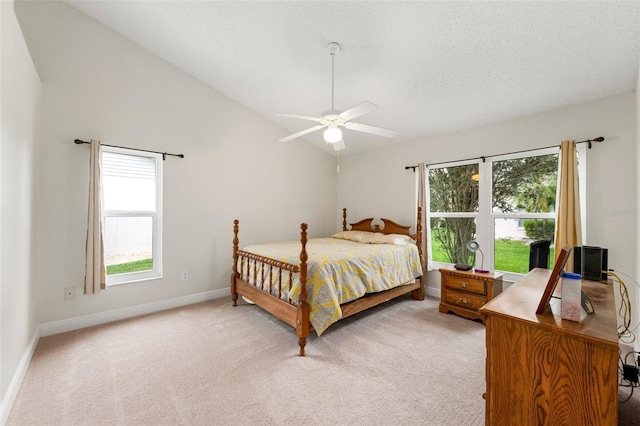 2015 W Del Webb Blvd, Sun City Center, FL 33573 - bedroom with lofted ceiling, baseboards, light colored carpet, a ceiling fan, and a textured ceiling