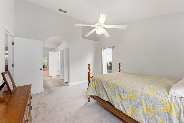 2015 W Del Webb Blvd, Sun City Center, FL 33573 - carpeted bedroom with arched walkways, multiple windows, and ceiling fan