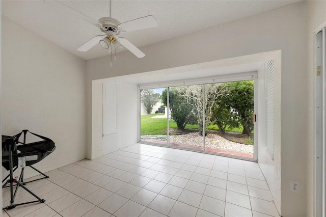 2015 W Del Webb Blvd, Sun City Center, FL 33573 - empty room with plenty of natural light, light tile patterned floors, and a ceiling fan