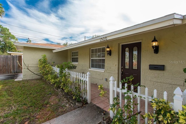 1500 Ohio Ave NE, Saint Petersburg, FL 33703 - entrance to property featuring fence and stucco siding