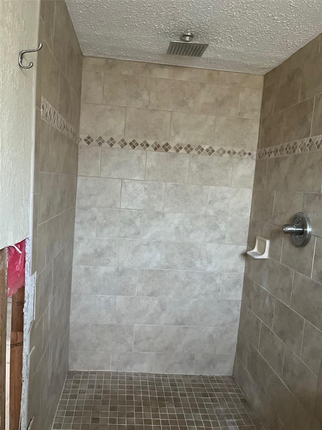 1500 Ohio Ave NE, Saint Petersburg, FL 33703 - full bath with a tile shower and a textured ceiling