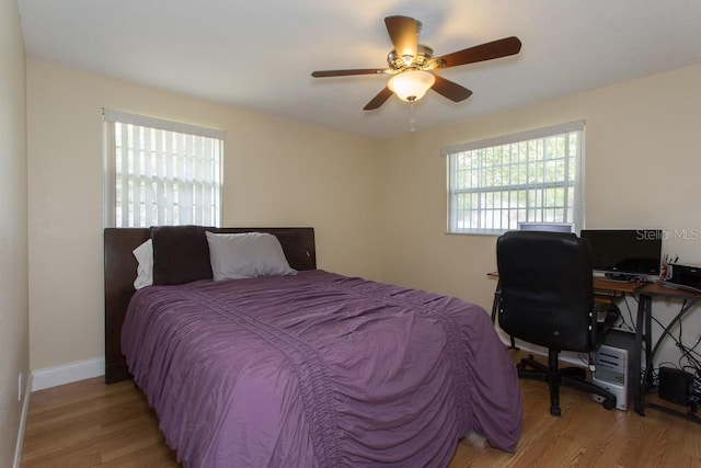 1500 Ohio Ave NE, Saint Petersburg, FL 33703 - bedroom with light wood-style floors, ceiling fan, an office area, and baseboards