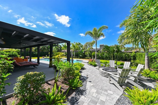 13916 Wellesford Way, Tampa, FL 33624 - view of property's community featuring a fire pit, a patio area, and a swimming pool