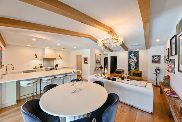 13916 Wellesford Way, Tampa, FL 33624 - dining space featuring beam ceiling, light wood-type flooring, a chandelier, recessed lighting, and baseboards