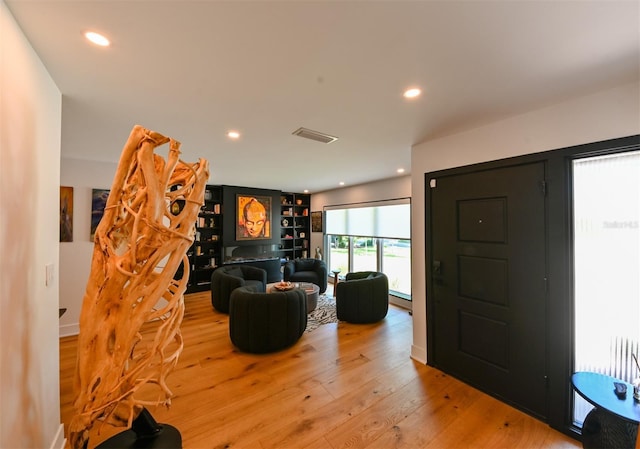 13916 Wellesford Way, Tampa, FL 33624 - living room with light wood-type flooring and recessed lighting