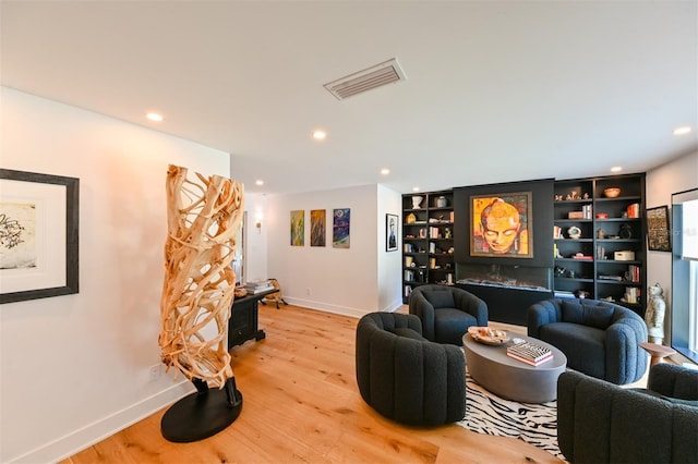 13916 Wellesford Way, Tampa, FL 33624 - living room featuring recessed lighting, baseboards, and light wood-style floors