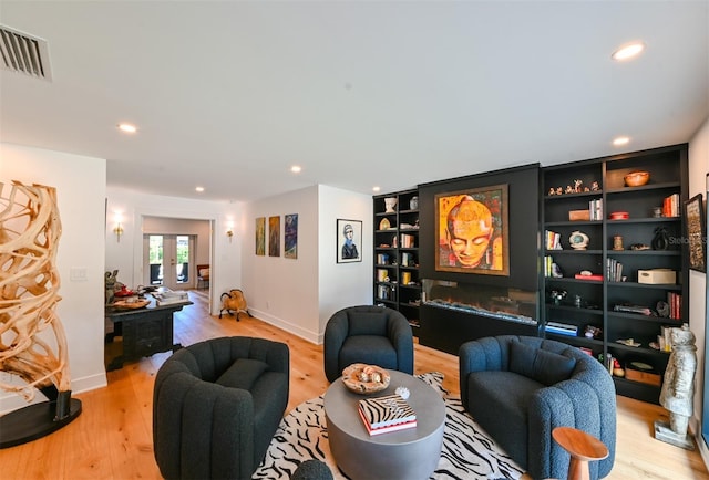 13916 Wellesford Way, Tampa, FL 33624 - living room featuring light wood-style floors, recessed lighting, and baseboards