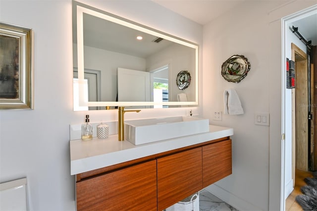 13916 Wellesford Way, Tampa, FL 33624 - bathroom with vanity, baseboards, recessed lighting, and marble finish floors