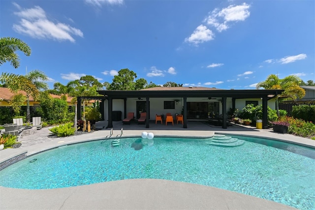 13916 Wellesford Way, Tampa, FL 33624 - view of swimming pool featuring ceiling fan, a patio, and fence