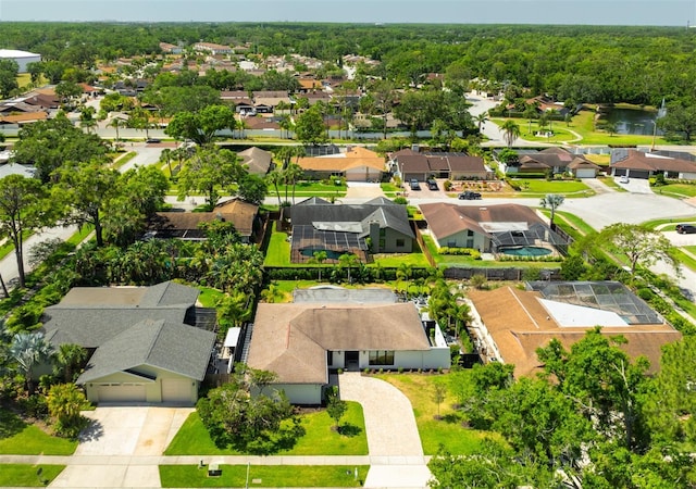 13916 Wellesford Way, Tampa, FL 33624 - aerial perspective of suburban area with a nearby body of water and a heavily wooded area