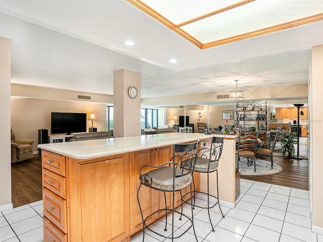 830 S Gulfview Blvd Unit 102, Clearwater Beach, FL 33767 - kitchen featuring open floor plan, light countertops, light tile patterned floors, and recessed lighting