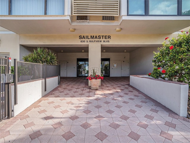 830 S Gulfview Blvd Unit 102, Clearwater Beach, FL 33767 - property entrance featuring stucco siding