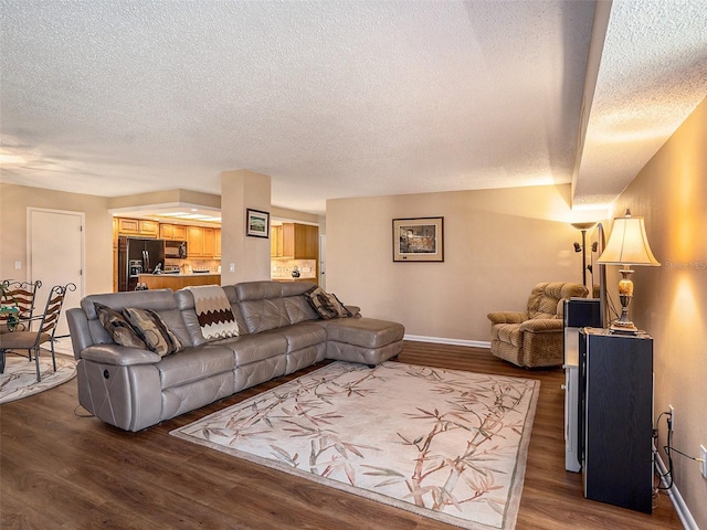 830 S Gulfview Blvd Unit 102, Clearwater Beach, FL 33767 - living room with a textured ceiling, wood finished floors, and baseboards