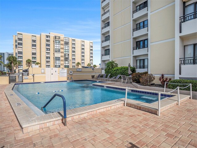 830 S Gulfview Blvd Unit 102, Clearwater Beach, FL 33767 - community pool featuring a patio