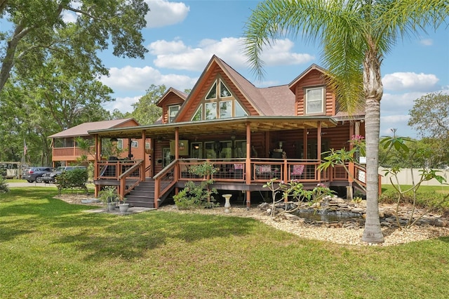5817 Myrtle Ln, Tampa, FL 33625 - rear view of property with a yard