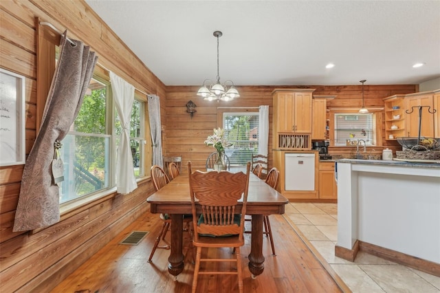 5817 Myrtle Ln, Tampa, FL 33625 - dining area with plenty of natural light, a chandelier, light wood-style floors, and recessed lighting