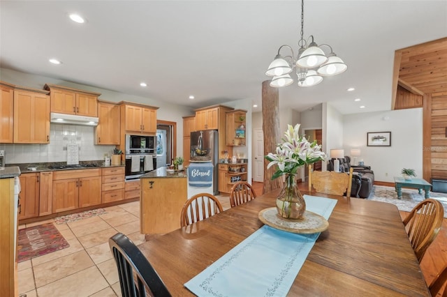 5817 Myrtle Ln, Tampa, FL 33625 - dining room featuring light tile patterned floors, recessed lighting, and a chandelier