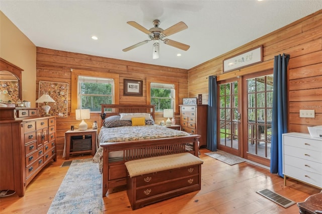 5817 Myrtle Ln, Tampa, FL 33625 - bedroom featuring access to exterior, wooden walls, light wood finished floors, recessed lighting, and ceiling fan