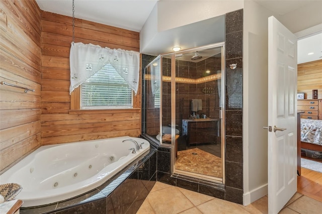 5817 Myrtle Ln, Tampa, FL 33625 - full bath featuring tile patterned floors, a stall shower, a tub with jets, and wood walls