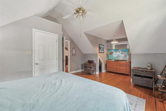 5817 Myrtle Ln, Tampa, FL 33625 - bedroom with vaulted ceiling, wood finished floors, a ceiling fan, and baseboards