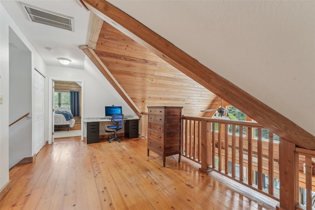 5817 Myrtle Ln, Tampa, FL 33625 - bonus room featuring an office area, vaulted ceiling, light wood-type flooring, and a ceiling fan
