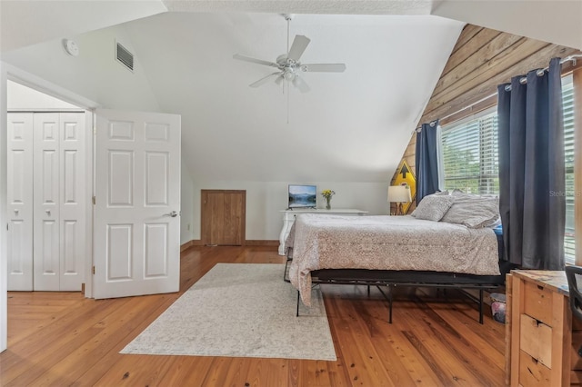 5817 Myrtle Ln, Tampa, FL 33625 - bedroom with vaulted ceiling, light wood-style flooring, and ceiling fan