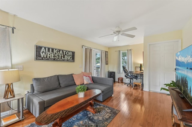 5817 Myrtle Ln, Tampa, FL 33625 - living area featuring a ceiling fan, a desk, wood finished floors, and baseboards