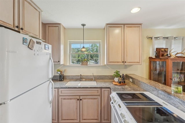 5817 Myrtle Ln, Tampa, FL 33625 - kitchen featuring freestanding refrigerator, a sink, stove, light brown cabinets, and light stone counters