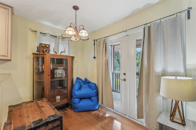 5817 Myrtle Ln, Tampa, FL 33625 - doorway featuring a chandelier and wood finished floors