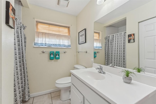 5817 Myrtle Ln, Tampa, FL 33625 - full bathroom featuring toilet, tile patterned flooring, vanity, a shower with curtain, and baseboards