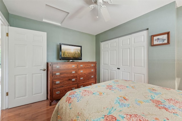 5817 Myrtle Ln, Tampa, FL 33625 - bedroom featuring attic access, wood finished floors, a closet, and a ceiling fan