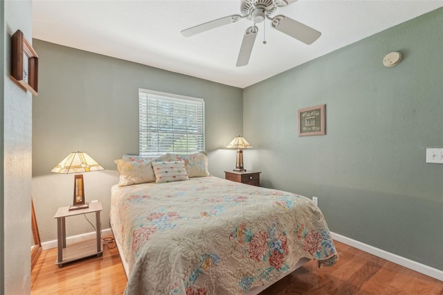 5817 Myrtle Ln, Tampa, FL 33625 - bedroom featuring wood finished floors, baseboards, and a ceiling fan