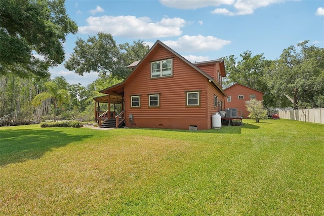 5817 Myrtle Ln, Tampa, FL 33625 - back of property with crawl space and cooling unit