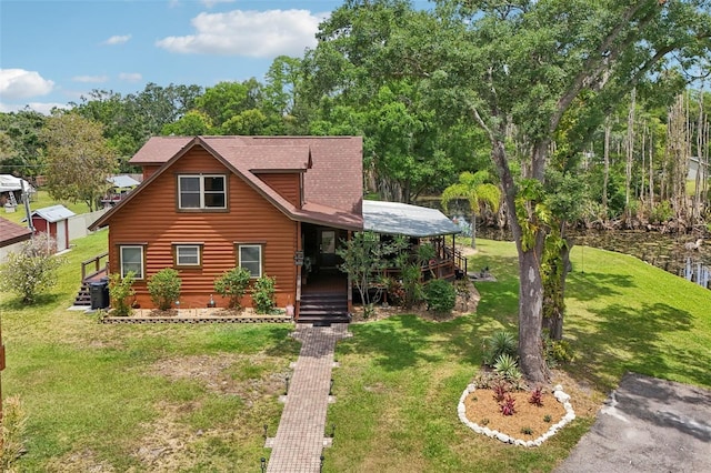 5817 Myrtle Ln, Tampa, FL 33625 - view of front of house with a front yard, log veneer siding, and a shingled roof