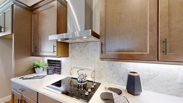 426 Bourganville Dr, Palm Coast, FL 32137 - kitchen featuring wall chimney exhaust hood, black electric stovetop, and tasteful backsplash