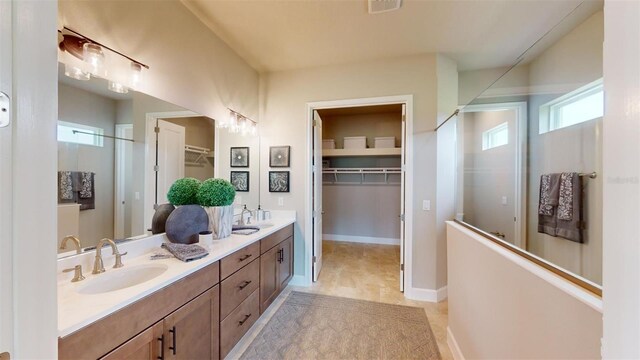 426 Bourganville Dr, Palm Coast, FL 32137 - full bath featuring a walk in closet and double vanity