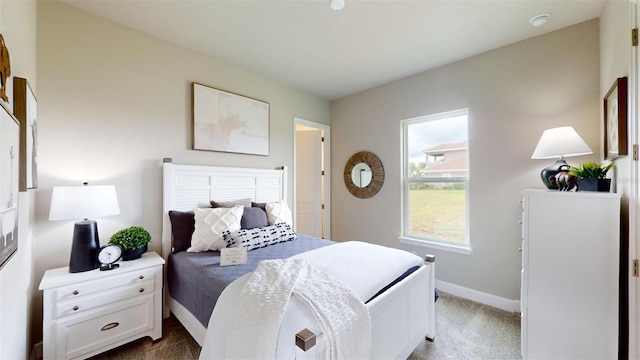 426 Bourganville Dr, Palm Coast, FL 32137 - bedroom with carpet flooring and baseboards
