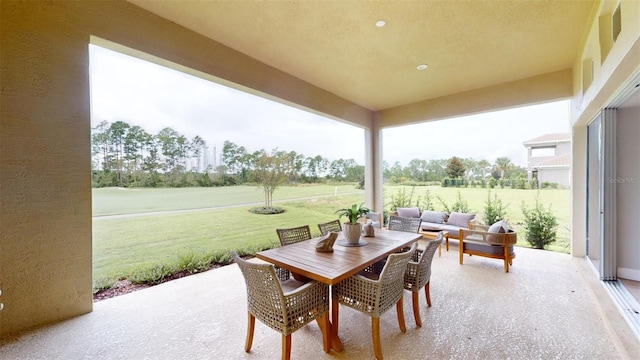 426 Bourganville Dr, Palm Coast, FL 32137 - view of patio featuring an outdoor hangout area and outdoor dining space