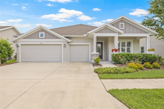 4166 Epic Cv, Land O Lakes, FL 34638 - craftsman inspired home featuring an attached garage, driveway, stucco siding, and board and batten siding