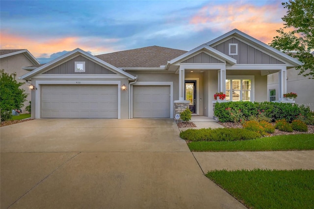 4166 Epic Cv, Land O Lakes, FL 34638 - craftsman-style home with driveway, an attached garage, board and batten siding, and stucco siding