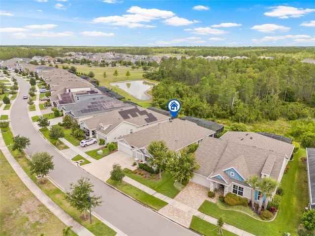 4166 Epic Cv, Land O Lakes, FL 34638 - aerial view of residential area with a large body of water and a forest