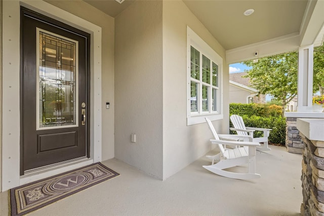 4166 Epic Cv, Land O Lakes, FL 34638 - view of exterior entry with a porch and stucco siding