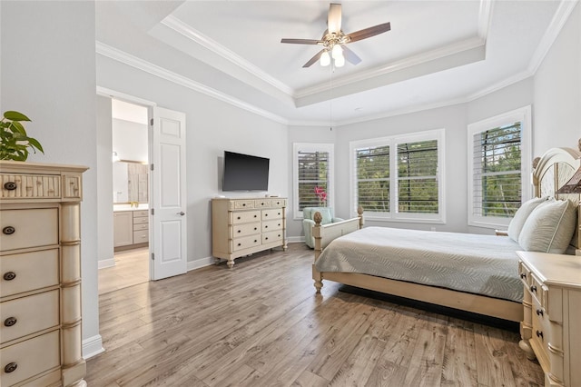 4166 Epic Cv, Land O Lakes, FL 34638 - bedroom with a tray ceiling, light wood-type flooring, ensuite bath, ornamental molding, and baseboards