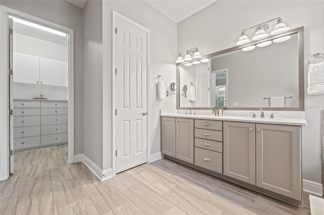 4166 Epic Cv, Land O Lakes, FL 34638 - bathroom featuring double vanity and baseboards
