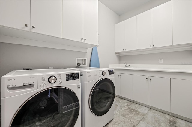 4166 Epic Cv, Land O Lakes, FL 34638 - laundry area featuring separate washer and dryer and cabinet space