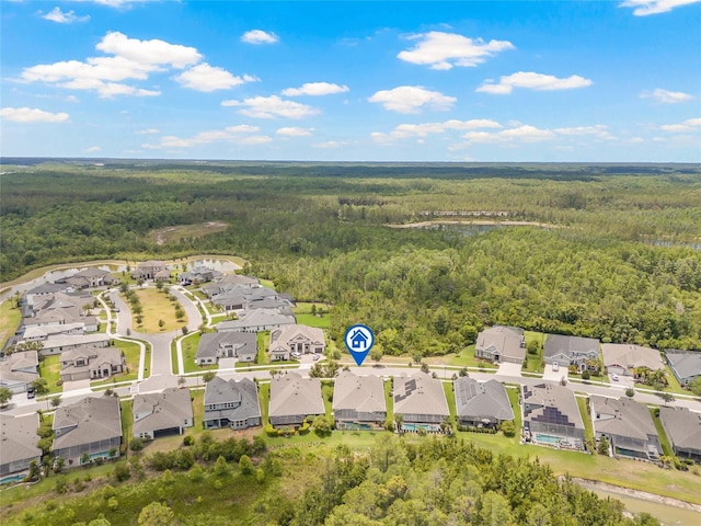 4166 Epic Cv, Land O Lakes, FL 34638 - aerial perspective of suburban area with a heavily wooded area