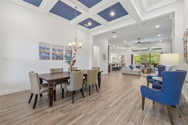 16712 Courtyard Loop, Land O Lakes, FL 34638 - dining room with a chandelier, coffered ceiling, ornamental molding, beam ceiling, and a ceiling fan
