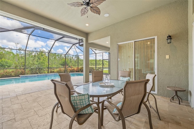 16712 Courtyard Loop, Land O Lakes, FL 34638 - view of patio with a ceiling fan, an outdoor pool, a lanai, and outdoor dining area