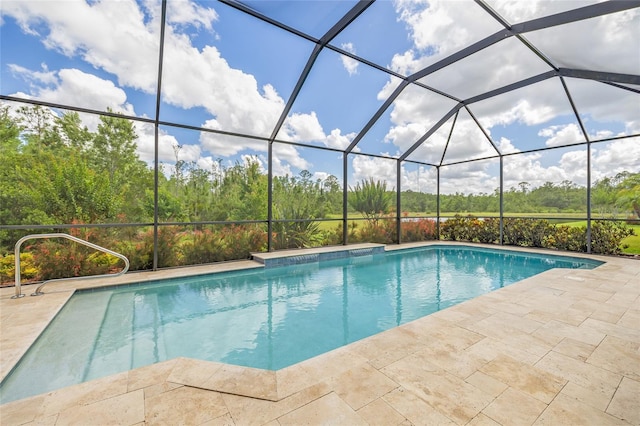 16712 Courtyard Loop, Land O Lakes, FL 34638 - outdoor pool featuring a patio, glass enclosure, and view of scattered trees